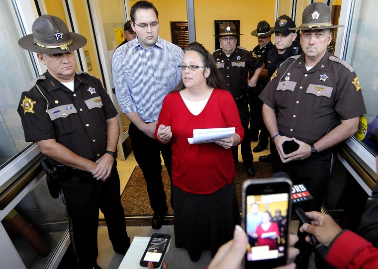 Image: Kim Davis addresses the media outside the Rowan County Clerk's Office in Morehead, Kentucky