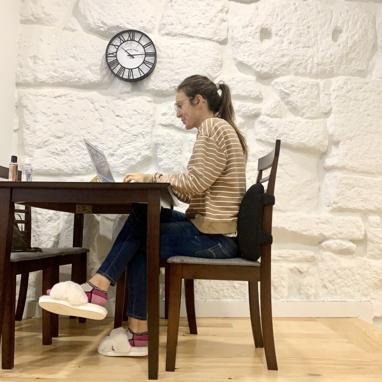 working from home at my kitchen table with my Everlasting Comfort lumbar cushion