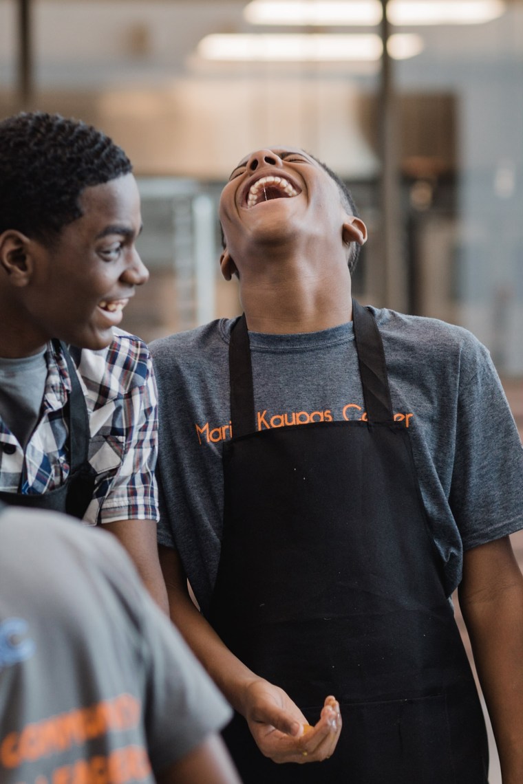 Students have fun learning to cook with Broussard during her I Knead Love workshop.