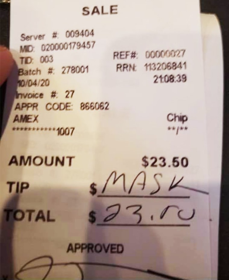 A customer wrote "mask" in the tip line on a receipt after being asked to wear a mask at John Henry's Pub of Ardmore in Ardmore, Penn., on Oct. 4, 2020.