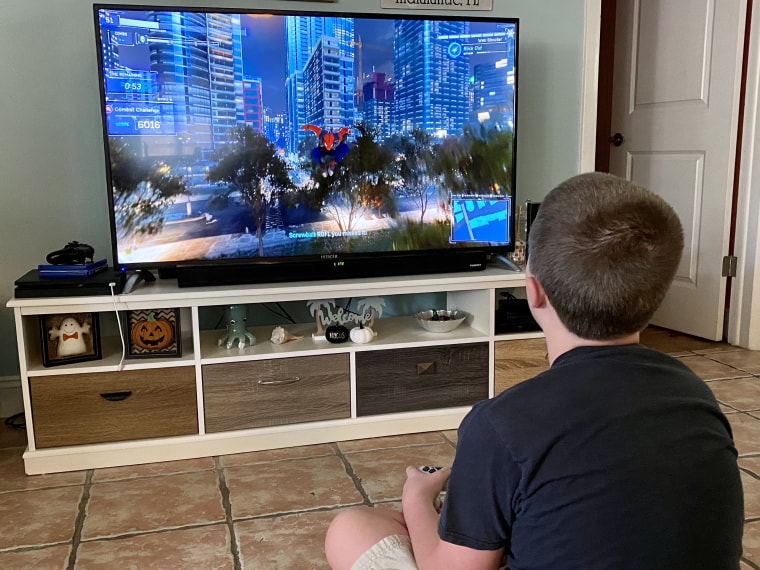 Competitive boyfriend and girlfriend playing video games funny Stock Photo