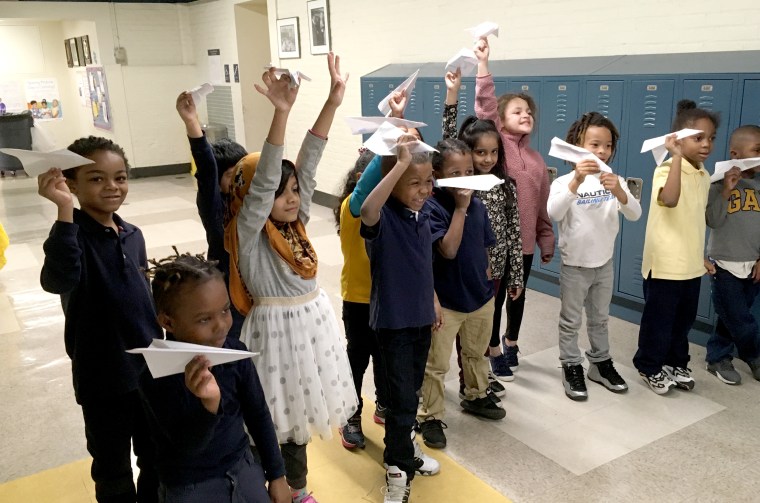 Image: At Arthur O. Eve #61 on Buffalo's east side, Sarah Malczewski's first grade gifted class prepares to launch the paper airplanes they designed to fly as far as possible.