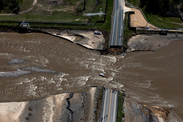 Image: A road collapsed after dams failed in Midland, Mich., on May 20, 2020.