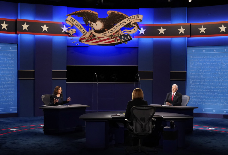 Image: Vice President Mike Pence listens as Democratic vice presidential candidate Sen. Kamala Harris, D-Calif., makes a point during the vice presidential debate