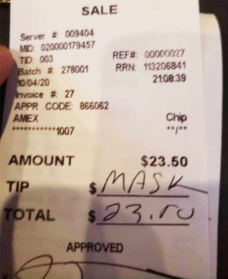 A customer wrote "mask" in the tip line on a receipt after being asked to wear a mask at John Henry's Pub of Ardmore in Ardmore, Penn., on Oct. 4, 2020.
