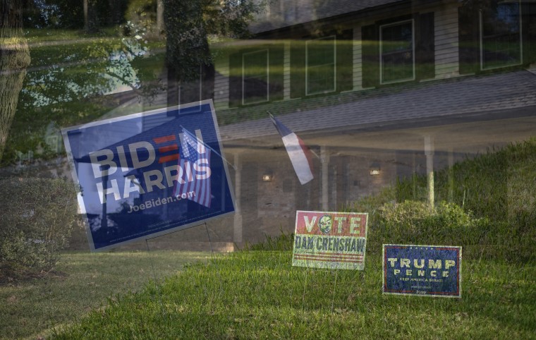 Image: Campaign signs adorn the lawns of houses in Prestonwood Forest, a neighborhood in the suburbs of Houston, on Oct. 7, 2020.