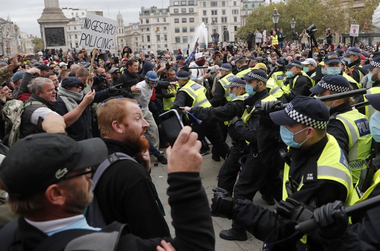 Image: Riot police face protesters who took part in a 'We Do Not Consent' rally at Trafalgar Square, organised by Stop New Normal, to protest against coronavirus restrictions, in London,