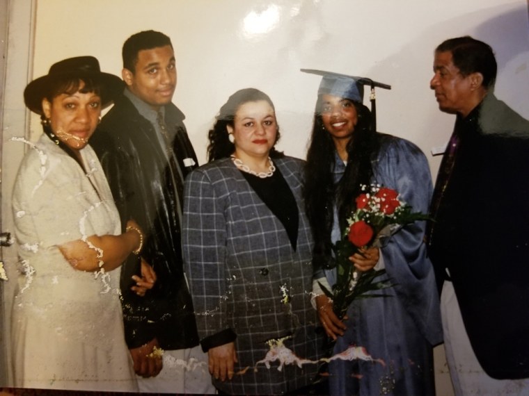 Deni Taveras with family and Uncle Marcial, on the right, after graduation.