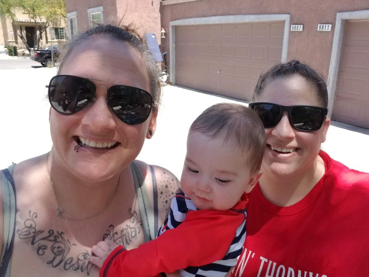 Amy and Robyn Malofy are pictured with their baby girl, Penelope. Amy Malofy had no choice but to leave her job during the coronavirus pandemic.