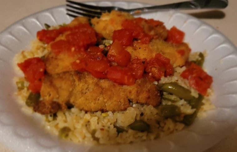 Blair Henze created this dish: "green bag chicken" atop rice pilaf with green beans and diced tomato.