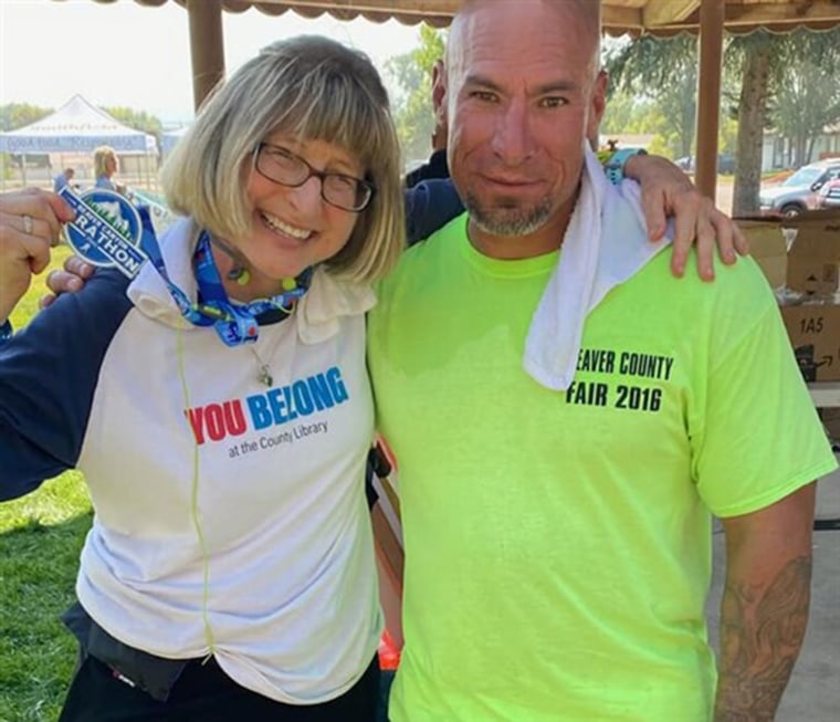 Carrie Kelley with Fidel Ybarra after finishing the Beaver Canyon Marathon on Oct. 3, 2020.