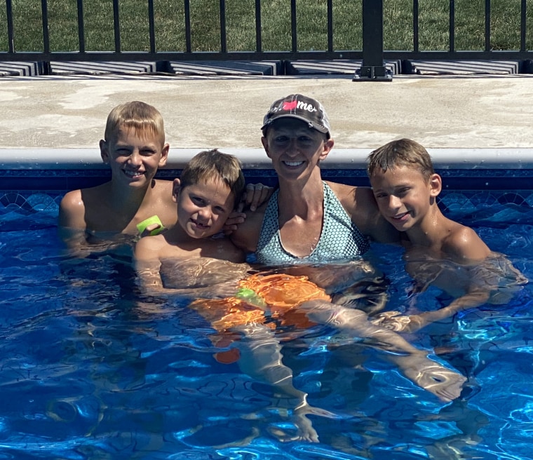 A complication with some of Heather Cramer's breast tissue meant her reconstructed breast implant became exposed and she now has an open wound after its removal. That makes swimming tougher, but she still treasures all her time with her children. 