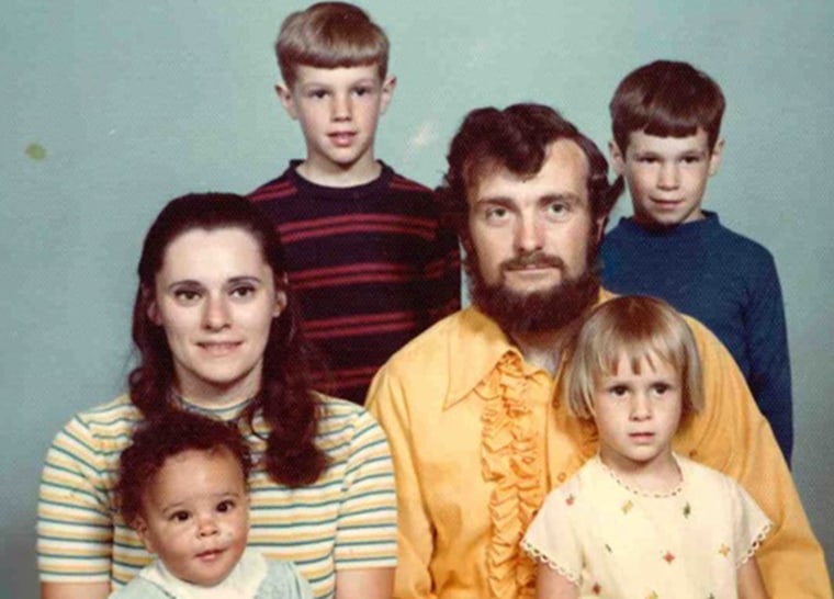 April Dinwoodie with her parents and family as a child.