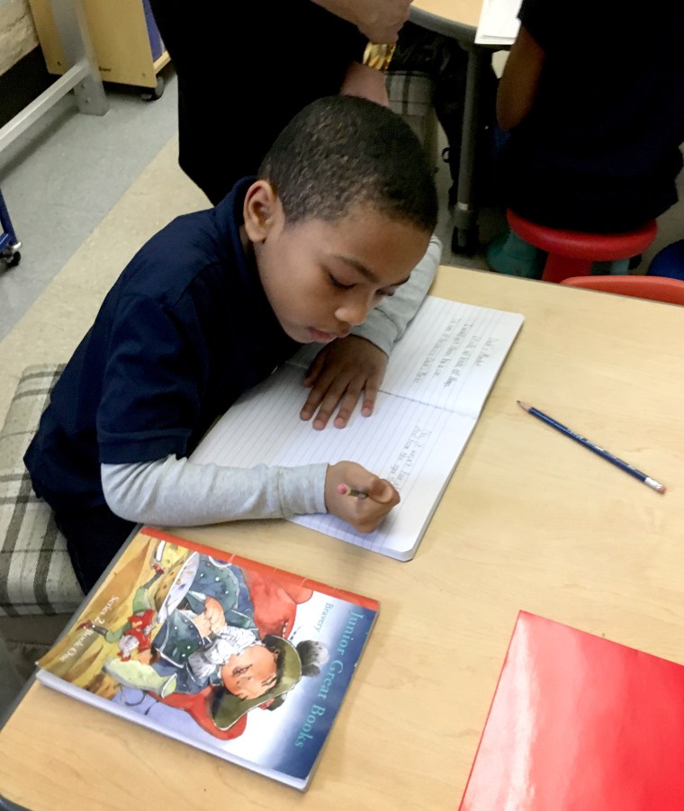 Image: Howard Thompson III writes in the Eve #61 gifted and talented class. His father hoped to move him to the more-established gifted program at Olmsted #64.