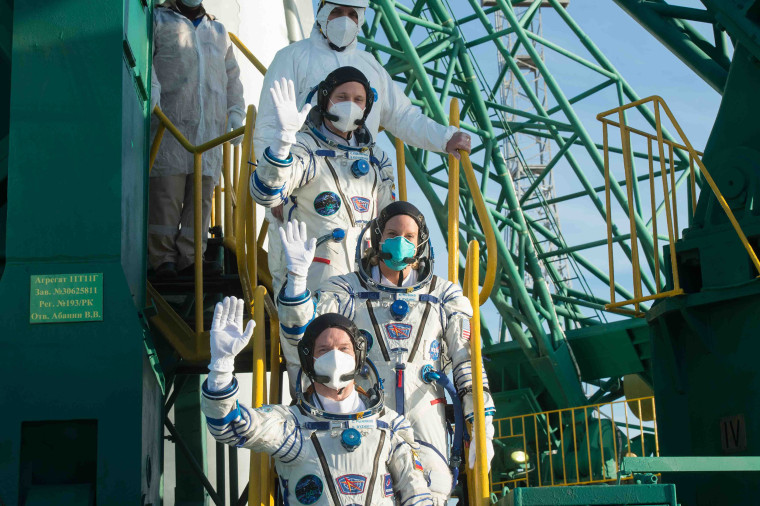 Image: NASA astronaut Kate Rubins and Russian cosmonauts Sergey Ryzhikov and Sergey Kud-Sverchkov, members of the International Space Station (ISS) expedition 64, wave as they board the Soyuz MS-17 spacecraft prior to the launch from the Russian-leased Ba