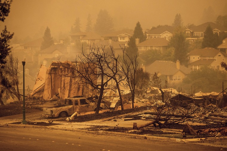 Image: Homes leveled by the Glass Fire line a street in the Skyhawk neighborhood of Santa Rosa, Calif