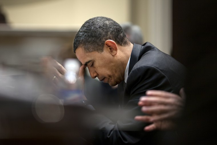 Image: President Barack Obama reflects during a budget meeting in the Roosevelt Room of the White House on Jan. 29, 2009.