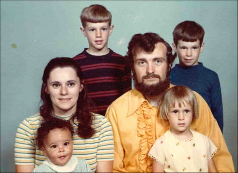 April Dinwoodie with her parents and family as a child.