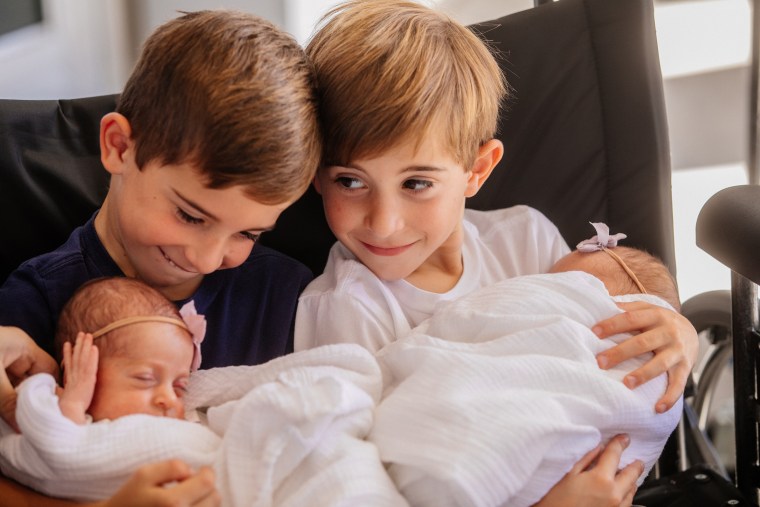 Grant and Cooper snuggled up with their sisters. 