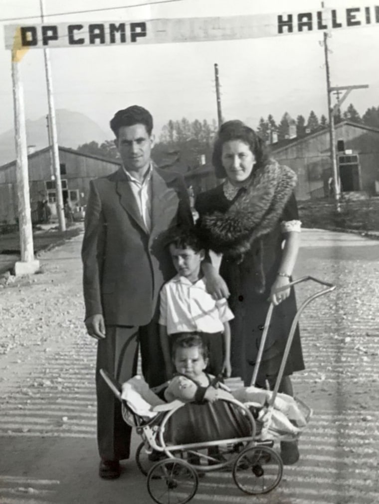 Israel "Sasha" Eisenberg, center, is photographed with his parents and younger brother Moty at the Hallein Displaced Persons Camp in Austria in 1947 after World War II.