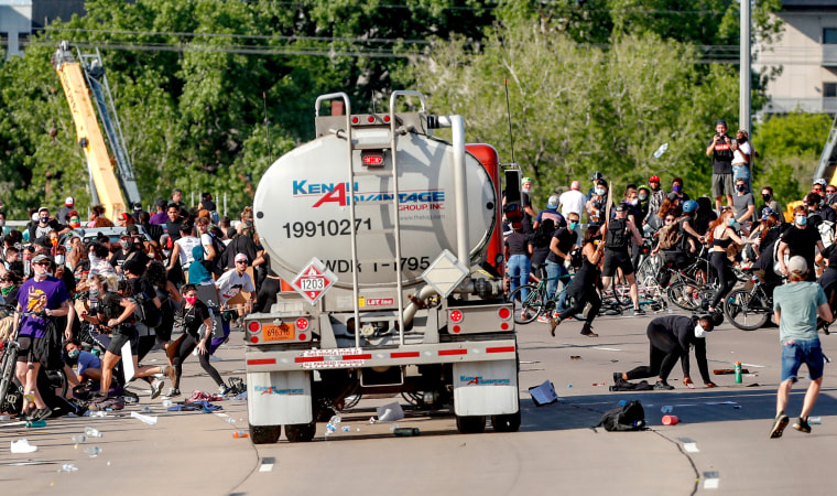 Image: Tanker truck drives into protesters on bridge