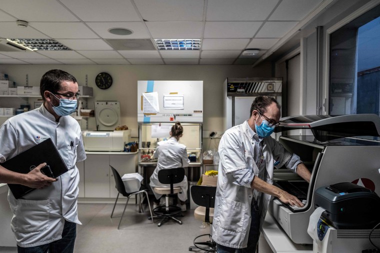 Image: A scientist works on the analysis of a tumor on Sept. 2, 2020 in Dijon Georges-Francois Leclerc Cancer Center, where a scientist developed a software to predict cancer recurrence odds.