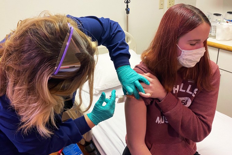 Katelyn Evans, 16, receives a Covid-19 vaccine during a trial at Cincinnati Children's Hospital Medical Center on Oct. 14.