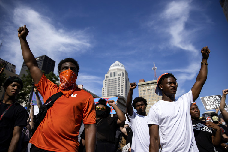 Image: Protesters march through downtown Louisville on June 5, 2020.