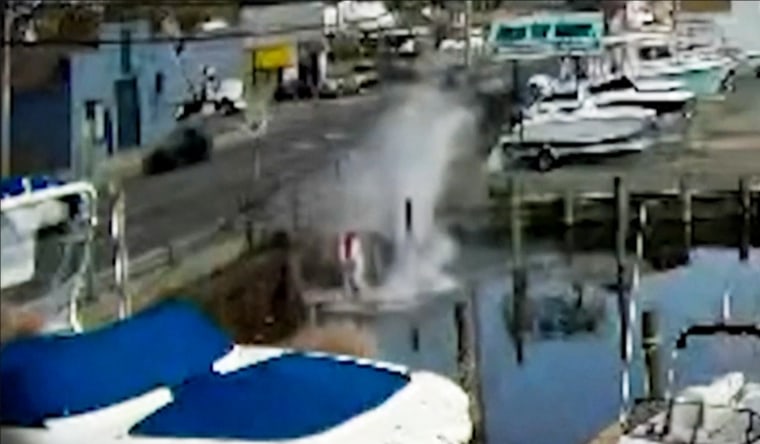 Security footage shows a car falling into water on Long Island, N.Y., on Oct. 19, 2020.