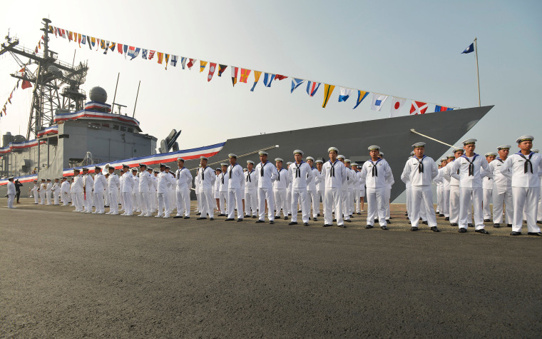 Image: Taiwan sailors parade in front of a new frigate during a ceremony to commission two Perry-class guided missile frigates from the U.S. into the Taiwan Navy, in the southern port of Kaohsiung