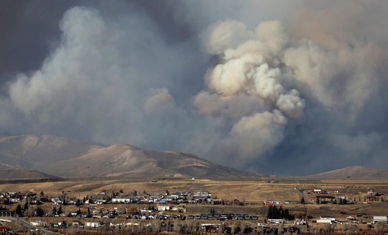 Image: Smoke fills the sky as the East Troublesome Fire burns outside Granby