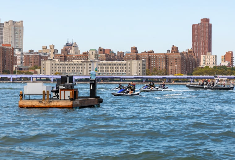 Jet skiers greet the distanced office. 