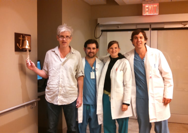 Mark Shanahan poses for a photo with members of his care team.