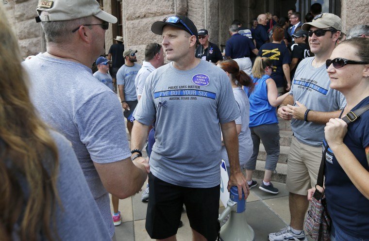 Police Lives Matter organizer Robert Chody thanks a rally supporter in Austin, Texas, on Sept. 19, 2015.
