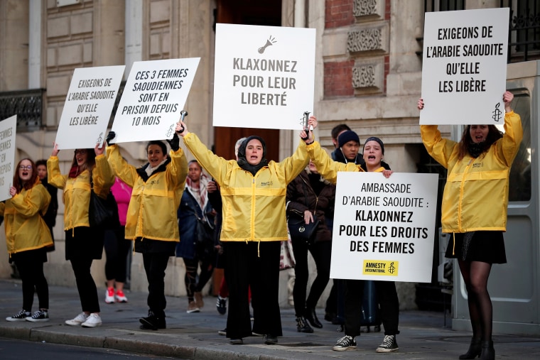 Image: Demonstrators from Amnesty International hold placards outside the Saudi Arabian Embassy to protest on International Women's day to urge Saudi authorities to release jailed women's rights activists Loujain al-Hathloul, Eman al-Nafjan and Aziza al-Y