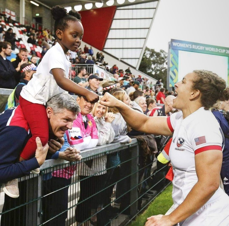 Naima Reddick greets a young fan.