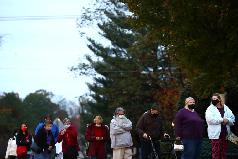 Image: People line up outside a polling station located at the McFaul Activity Center in Bel Air, Harford County, during early voting in Md