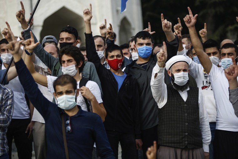 Image: Demonstrators chant slogans during an anti-France protest in Istanbul, Sunday, Oct. 25, 2020.