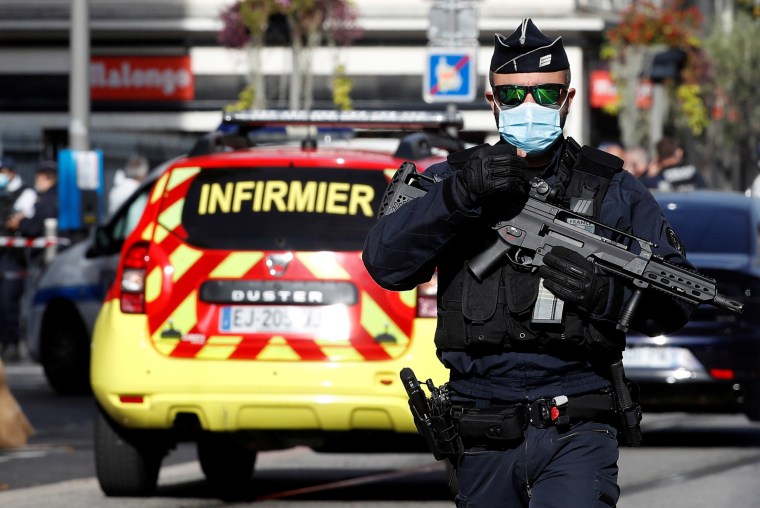 Image: A security officer guards the area after a reported knife attack at Notre Dame church in Nice, France