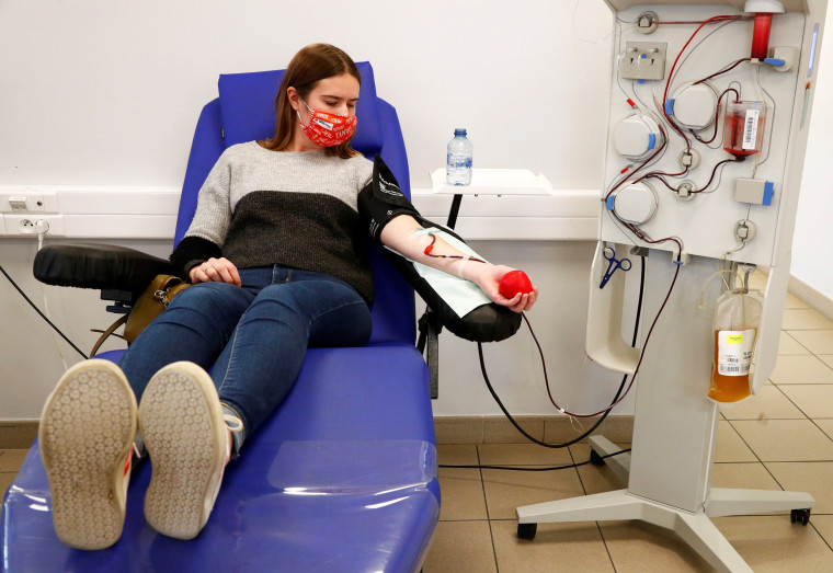 Image: Lili Deneve, who has recovered from coronavirus disease (COVID-19), donates plasma at the Belgian Red Cross blood collection center in Brussels