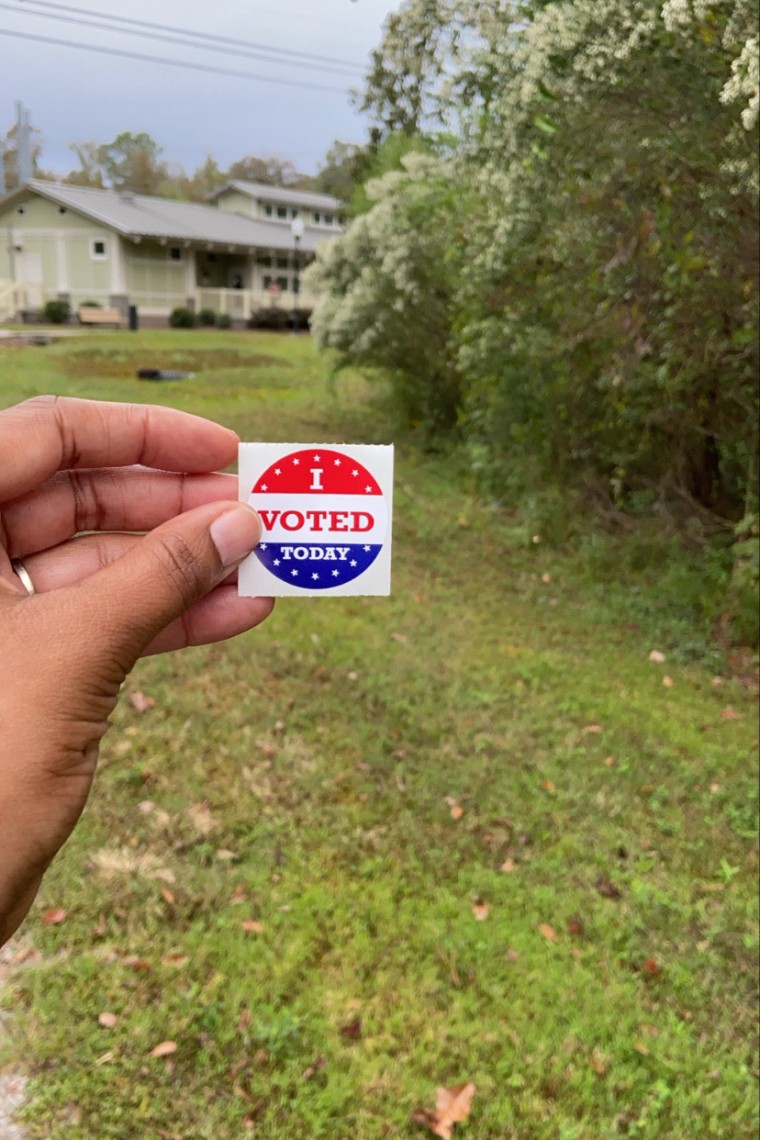 A voting sticker held by Sirena White-Singleton.