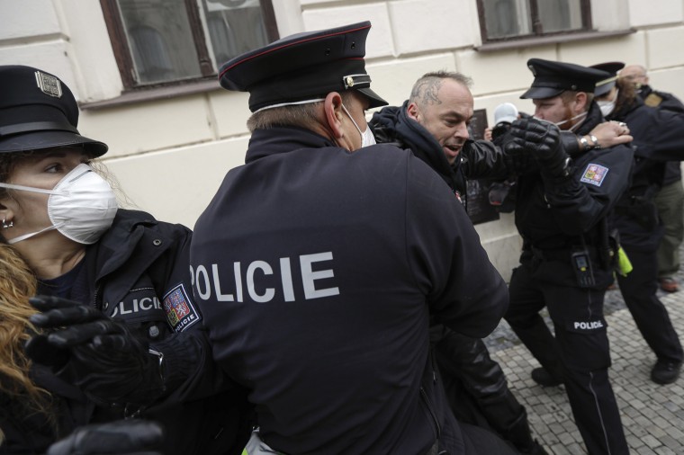 Image: Demonstrators scuffle with police while protesting the COVID-19 preventative measures downtown Prague, Czech Republic