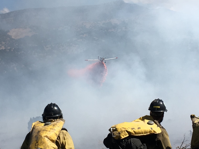 A plane drops retardant on a forest fire Jonathon Golden was fighting.