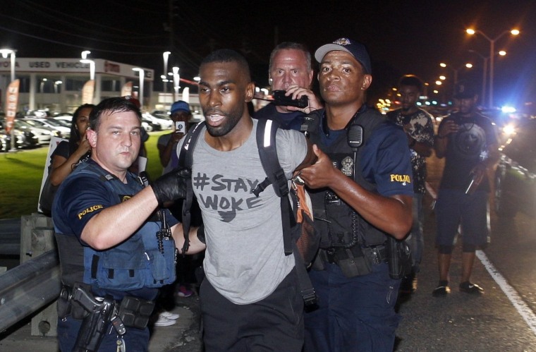 Image: Police arrest activist DeRay Mckesson during a protest along Airline Highway