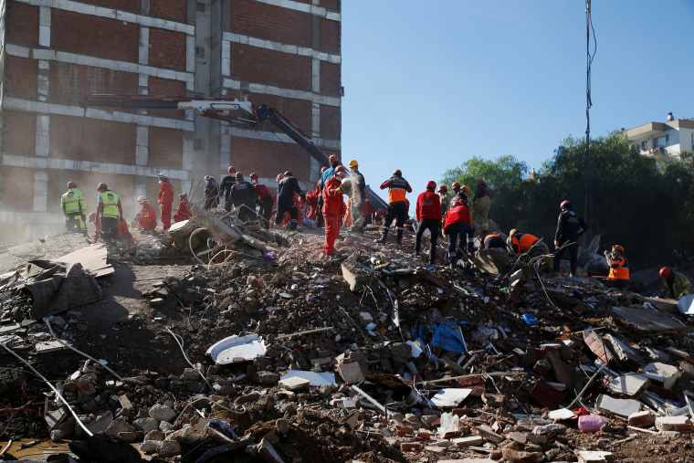 Image: Rescue operations take place on a site after an earthquake struck the Aegean Sea, in the coastal province of Izmir