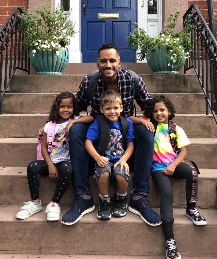 José Rolón posed for a photo with his son, Avery, and twin daughters, Lilah and London.