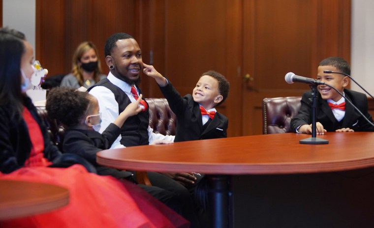 Robert Carter with her sons on adoption day.