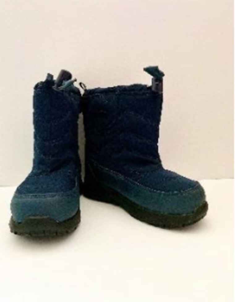 A pair of navy Cat &amp; Jack boots being recalled due to posing a possible choking hazard. 