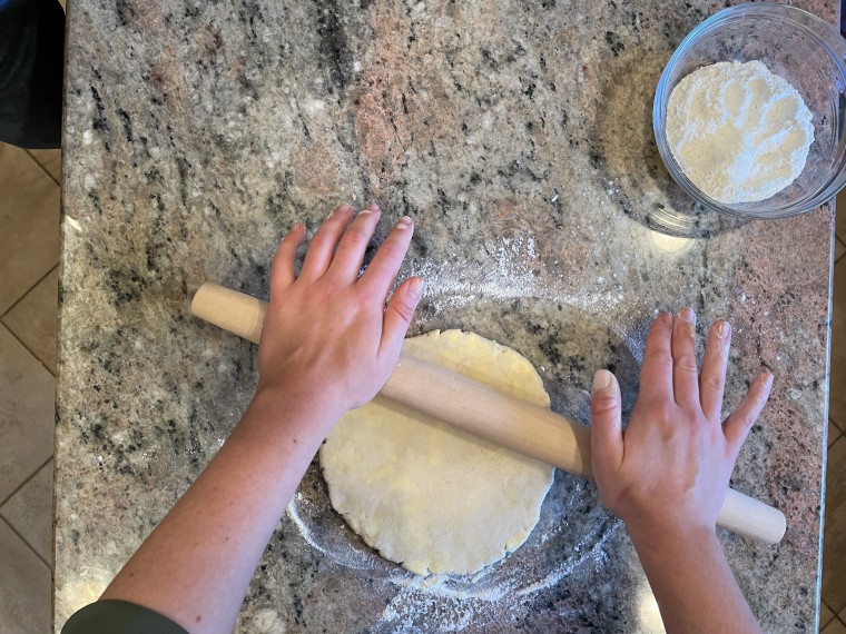Apply even pressure with your rolling pin in the middle and work outwards, rotating frequently to avoid an uneven dough.