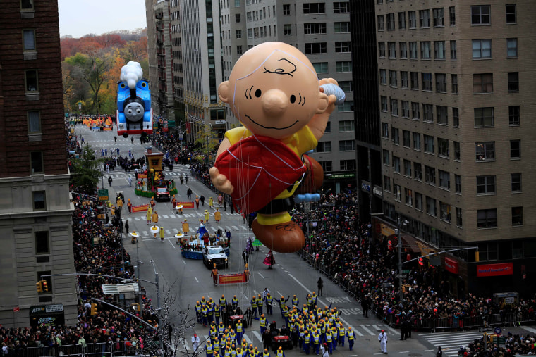 Image: A Charlie Brown giant balloon makes its way down 6th Avenue during the 90th Macy's Thanksgiving Day Parade in the Manhattan borough of New York